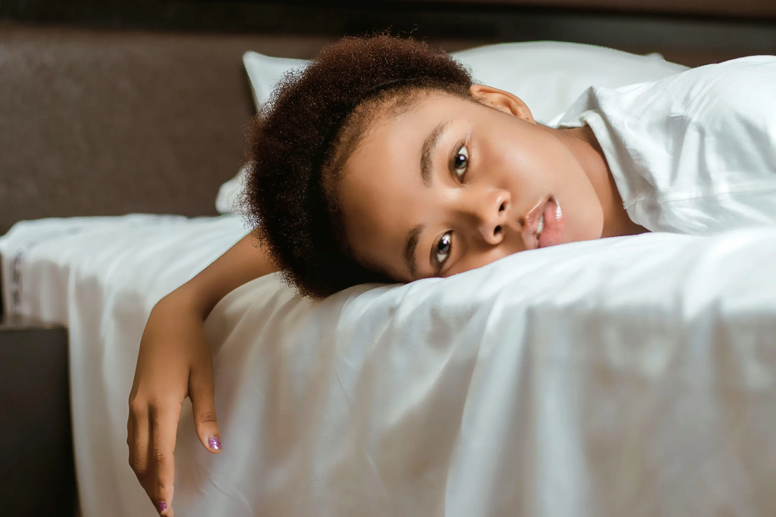 lazy woman lying on bed as part of trauma responses