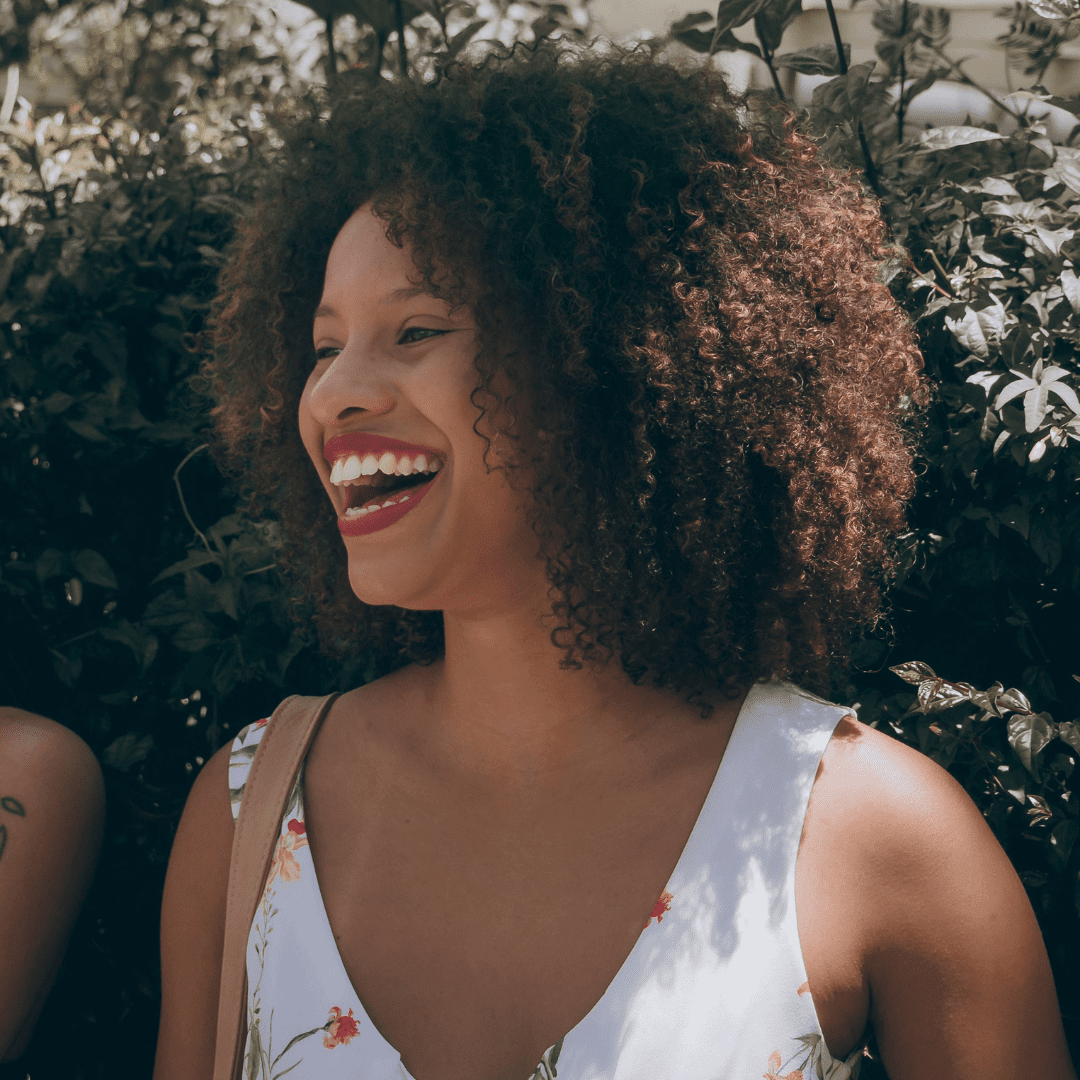 beautiful curly hair woman laughing