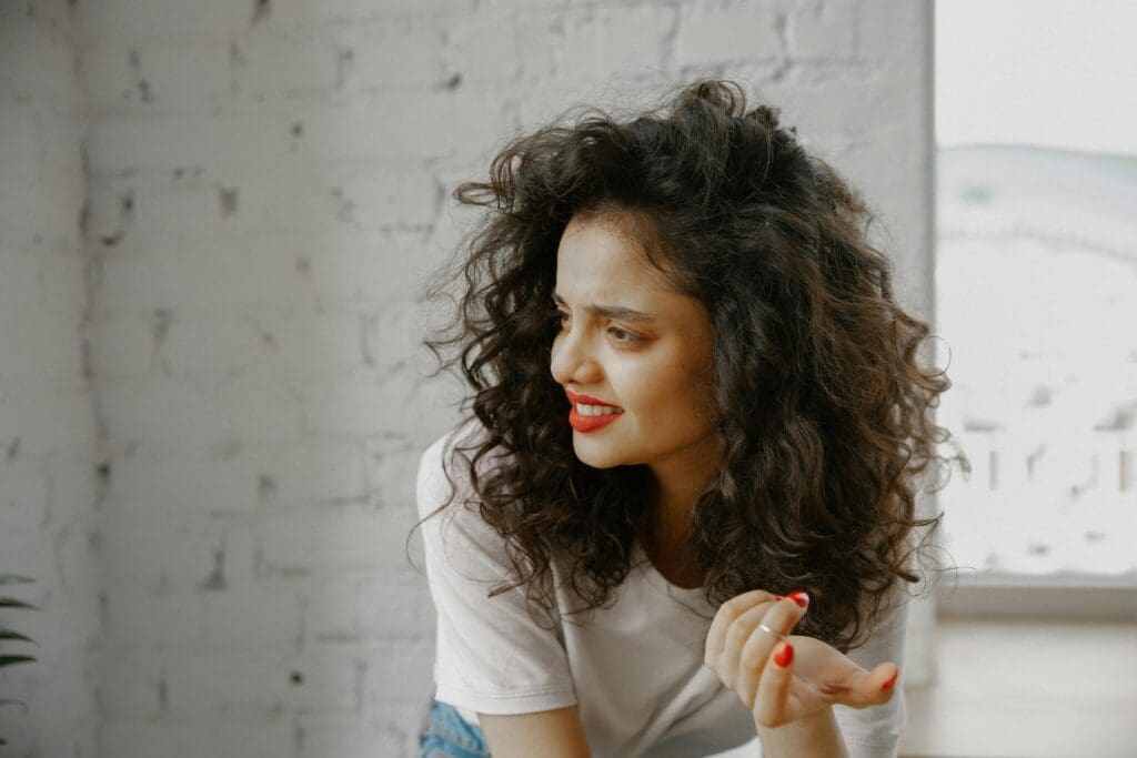 woman with brown hair looking confused